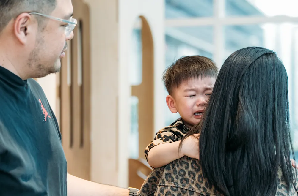 A toddler mid-meltdown at Naru Play Café while the other children carry on playing.