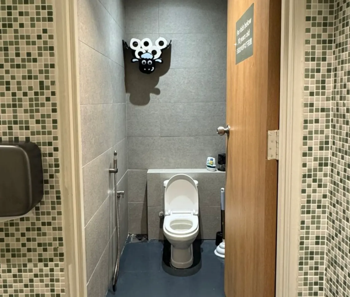 A child-sized potty at Naru Play Café — a low toilet seat scaled down for little people.
